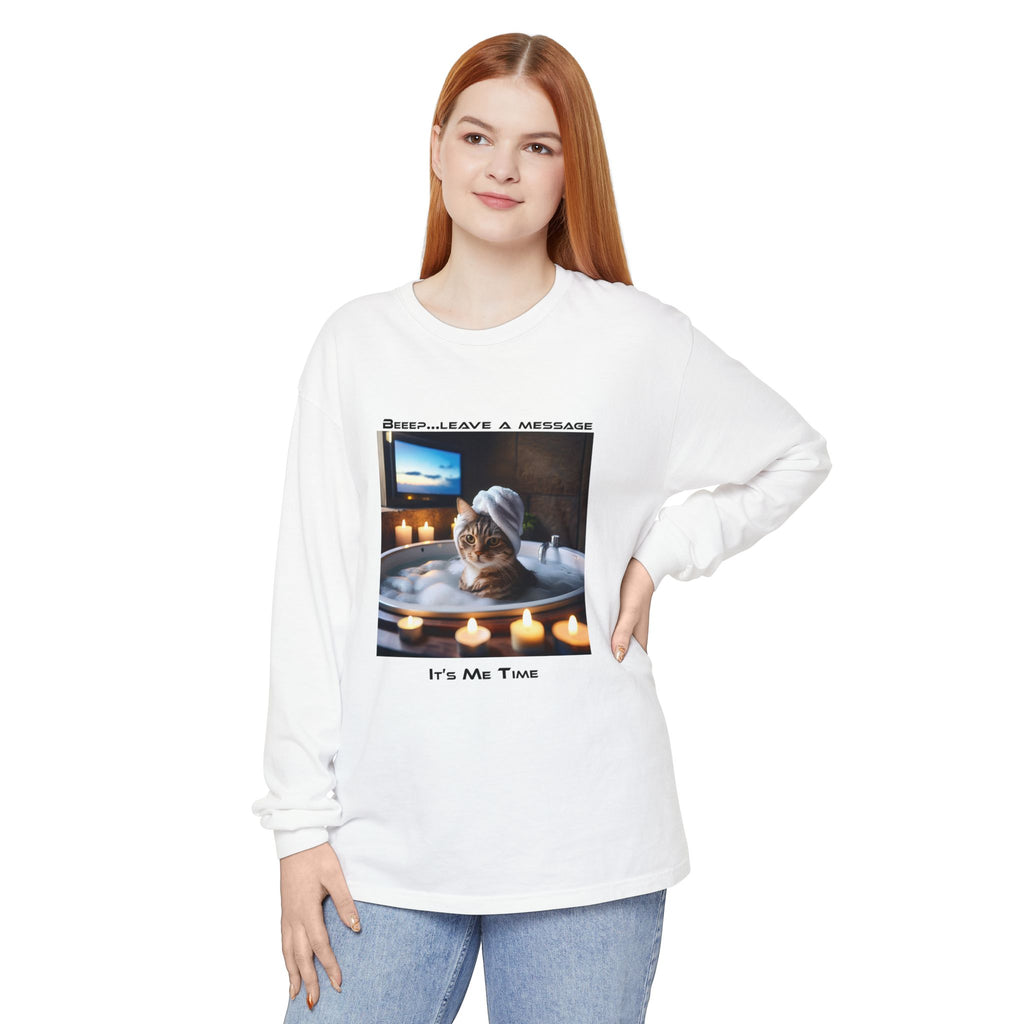 Person wearing a white long-sleeve shirt with a graphic design of a cat in a bathtub.